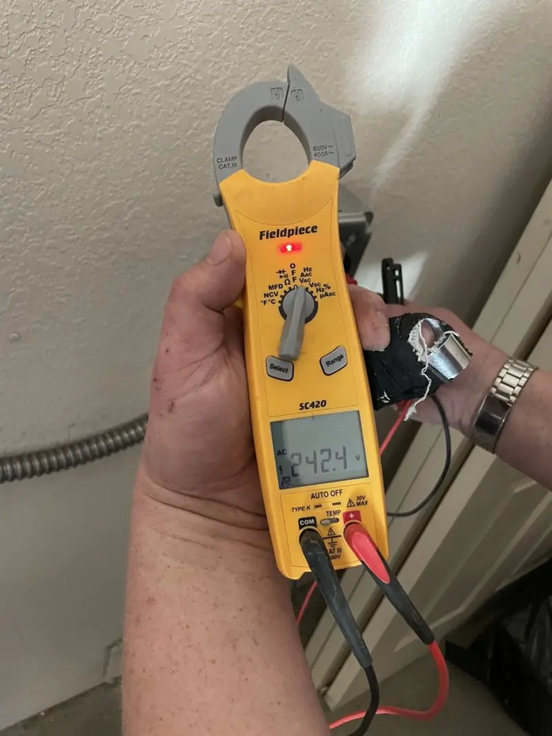 Voltage testing with clamp meter during Ceiling Fan Installation in Archer Lodge